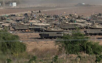 Israeli soldiers with tanks and APC (Armored Personnel Carriers) near the border with the Gaza Strip.