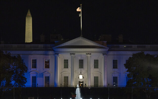 The White House is lit in blue and white, the colors of the Israeli flag, to underscore U.S. solidarity with Israel, Monday, Oct. 9, 2023, in Washington. (AP/Jon Elswick)