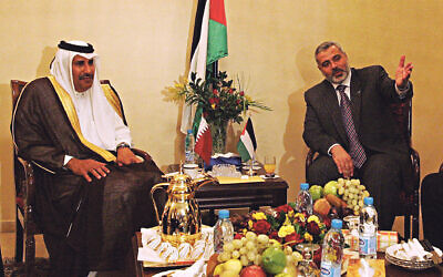 Hamas terror leader Ismail Haniyeh with then Qatari Foreign Minister Sheikh Hamad bin Jassim bin Jabr al-Thani during a meeting in Gaza City in October 2006. AFP PHOTO/Mohammed ABED  (Photo credit should read MOHAMMED ABED/AFP via Getty Images)
