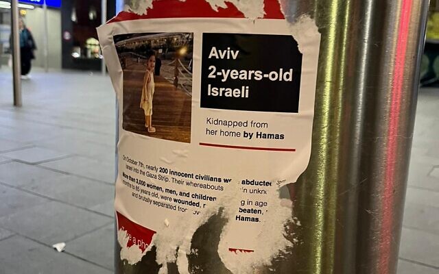 Ripped posters of Hamas kidnap victims.