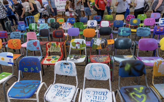 Members of the community in Ra’anana painted 230 empty chairs to represent the hostages in Gaza