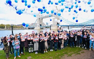 The balloons are released near Tower Bridge in London on Friday. Picture: Blake Ezra