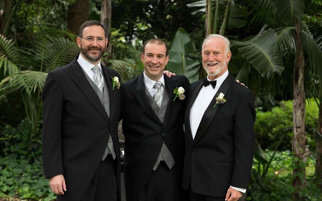 Zeddy (centre) with his father and brother, Rabbi Jeremy Lawrence.