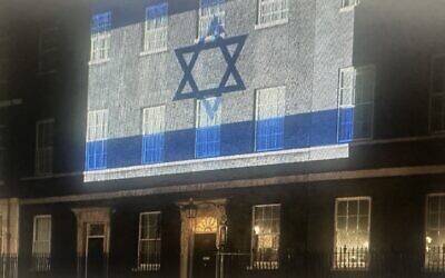 Downing Street lit up in the blue and white of the Israel flag on 8 October 2023