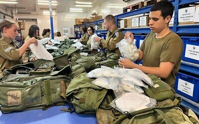 Soldiers prepare medical kits for distribution to reserve soldiers, October 10, 2023. (Israel Defense Forces)