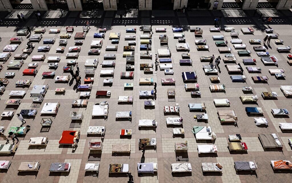 An installation at Jerusalem's Safra Square portrays 230 beds, empty since 7th October.