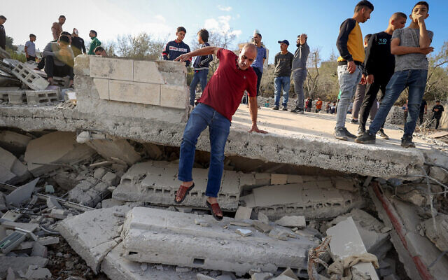 Palestinians inspect the demolished family home of Saleh al-Arouri, in the West Bank village of Arura, near Ramallah, on October 31, 2023.(FLASH90) via JTA