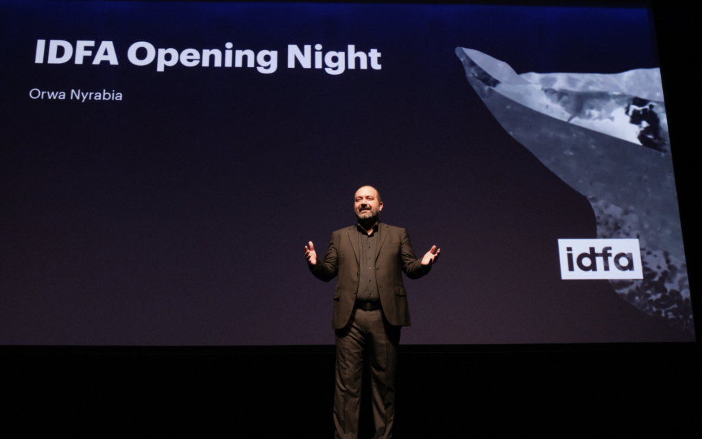 Festival director Orwa Nyrabia on stage in Amsterdam