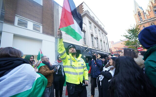 Social media personality 'goubtube' dressed as a police officer, takes part in a 'Day of Action for Palestine', organised by the Palestine Solidarity Campaign, outside Camden Town Hall.