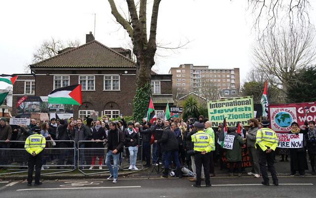 People take part in a protest opposite the Israeli ambassadors residence in Swiss Cottage, as part of the Stop the War Coalition's Day of Action for Palestine, in London. Picture date: Saturday December 16, 2023.