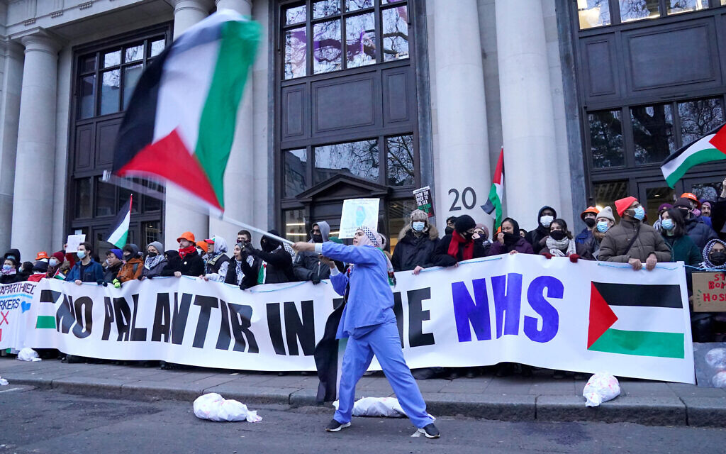 Health workers form a blockade in Soho Square during a protest outside the London headquarters of US tech giant Palantir, which was awarded a £330 million contract by NHS England last month to create a new data management system called the Federated Data Platform.