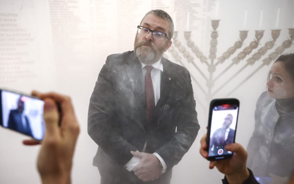 Grzegorz Braun seen shortly after using a fire extinguisher on a Hanukkah menorah in Poland's parliament building in Warsaw, Dec. 12, 2023. JTA: Beata Zawrzel/NurPhoto via Getty Images)