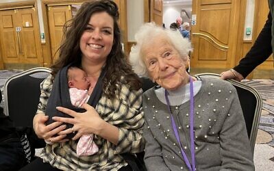 Limmud 2023 attendees Ella Lawton aged nine days, with mum Anna, next to Ruth Shire, aged 102.