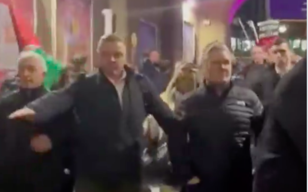 Keir Starmer being escorted past a pro-Palestinian protest in Glasgow
