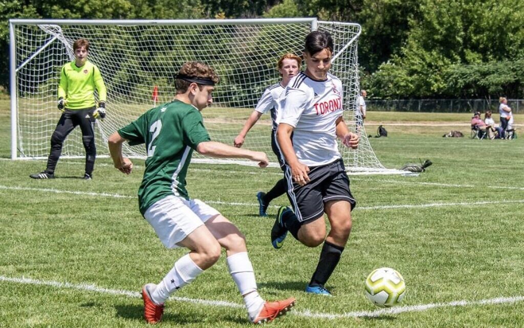 Adam (wearing dark shorts) in action