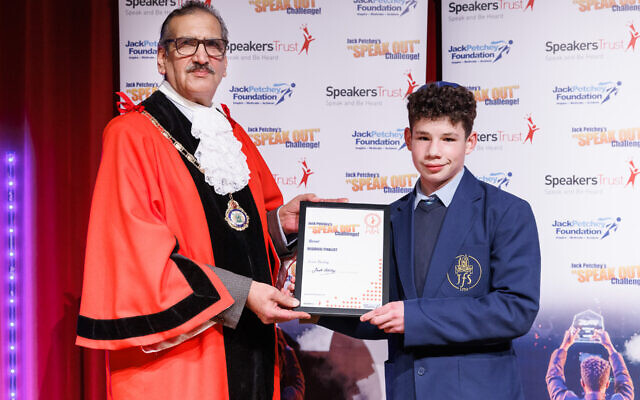 Evan Hartog receives his certificate from the Deputy Mayor of Brent, Councillor Tariq Dar, after finishing third at Jack Petchey's Speak Out Challenge in Kenton on Tuesday.