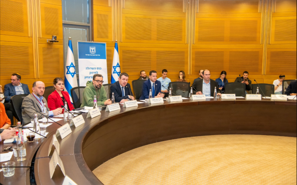Pic: Vahid Beheshti (centre, in green sweatshirt), Twitter screenshot, Vahid Beheshti account