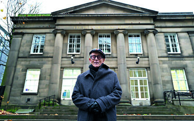 Danny standing in front of the Quaker Meetinghouse Manchester – he was able to come to Britain because of the sponsorship by the Quakers