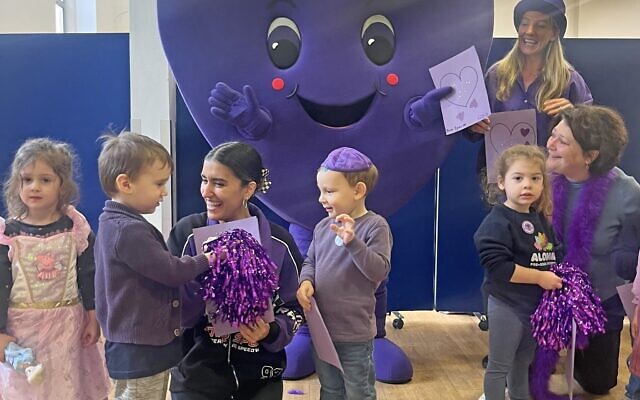 Alonim Pre-School children and staff and Chava Heart Jewish Care mascot get together to Go Purple