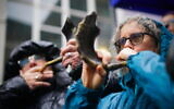 People blowing shofars and whistles in Abbey Road, London, led by Vanessa Feltz and Maureen Lipman, to show solidarity with the over 100 hostages held in Gaza.