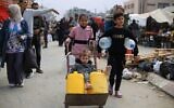 Children are on their way to fetch water in the southern Gaza Strip city of Rafah, on March 18, 2024. Credit: Khaled Omar/Xinhua/Alamy Live News