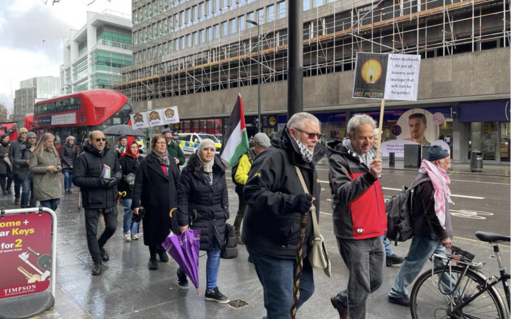 Peter Frankental with his banner at the pro-Palestinian protest on 3 March.