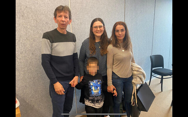 Julio and Gloria Vargas, with their National Organisation for Victims of Terror case-worker Shirel, and grandson Aviel. 27th March 2024, Tel Aviv. Pic: Michelle Rosenberg