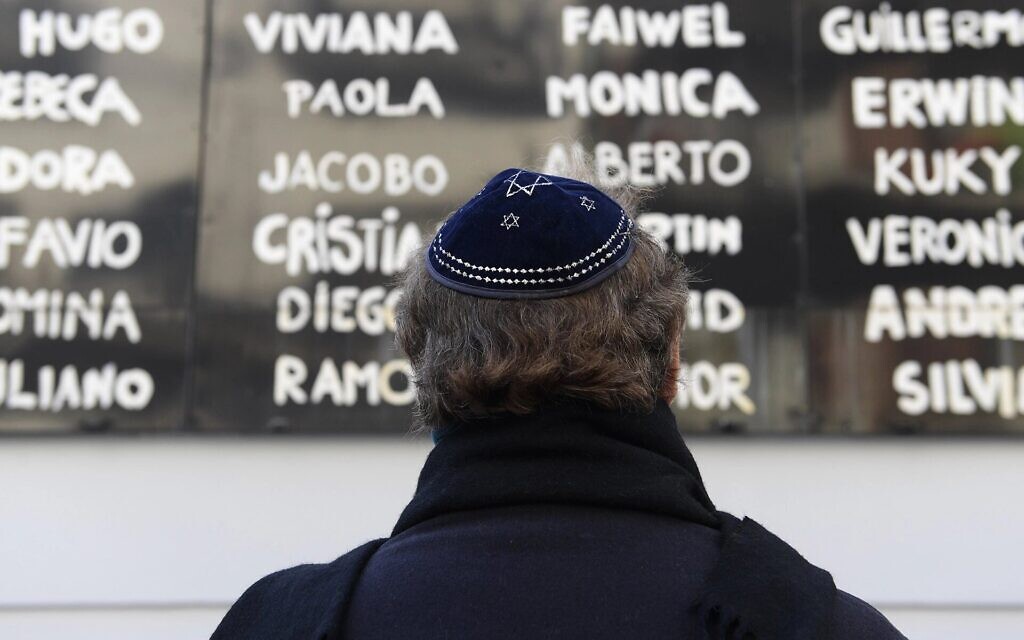 A man prays in front of the AMIA Jewish center during the commemoration of the 23rd anniversary of the terrorist bombing in Buenos Aires, July 18, 2017. (AFP/Juan Mabromata / Getty Images)