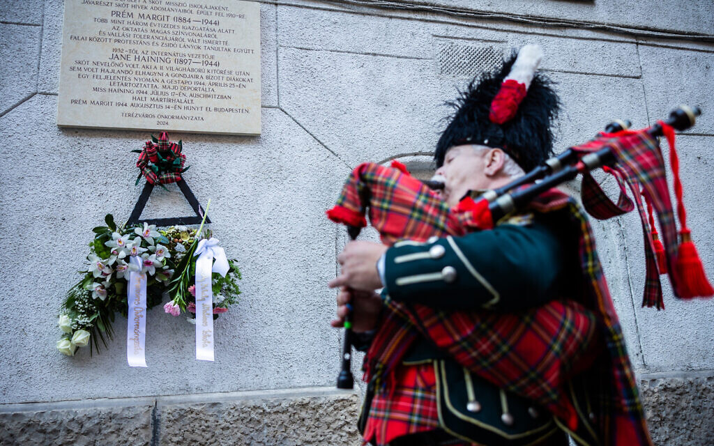 Undated handout photo issued by the Church of Scotland of a piper during the unveiling of the Jane Haining memorials outside St Columba's Church of Scotland in Budapest. Photo: Barta Bálint/Church of Scotland/PA Wire