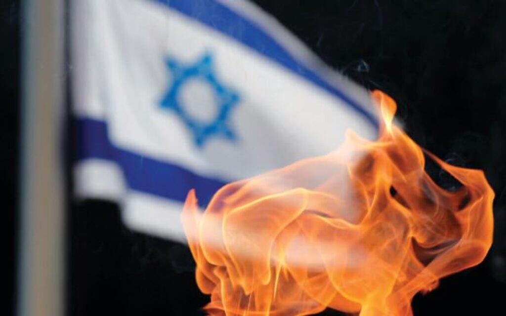 A TORCH burns on Jerusalem’s Mount Herzl, 2017(photo credit: AMIR COHEN/REUTERS)
