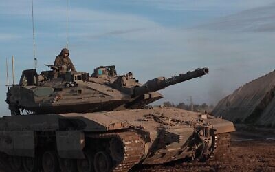 Israeli military tank returns from central Gaza amid continuing battles between Israel and the militant group Hamas on March 7, 2024 in Gaza border, southern Israel.