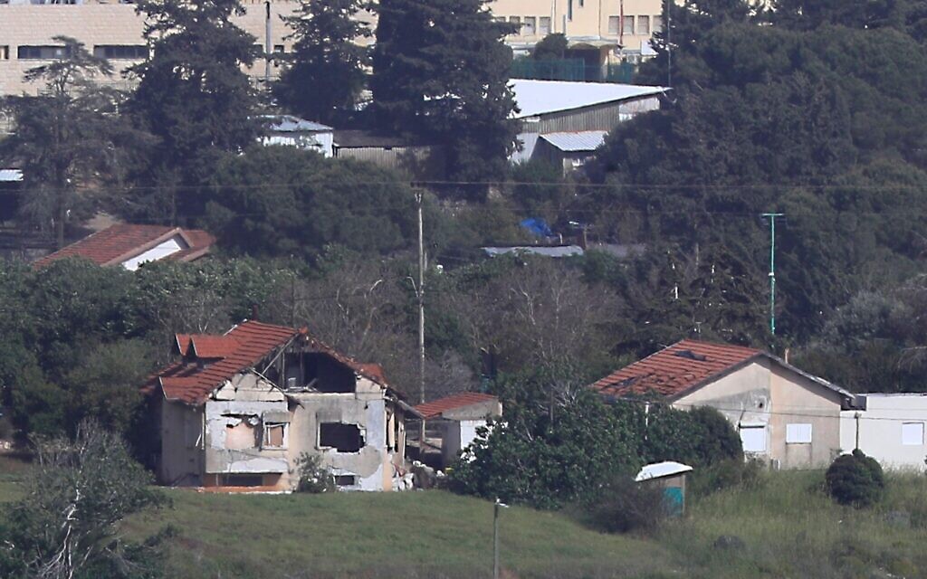 An Israeli house in the northern Israeli border town of Metula, which was damaged by Hezbollah shelling, is seen from the Lebanese side of the Lebanese-Israeli border village of Kfar Kila, south Lebanon