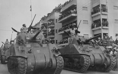 Military Parade with Tanks in Jerusalem on the First Anniversary of Israel's Independence Day in 1949. Photo by Fred Chesnik, KKL-JNF Photo Archive.