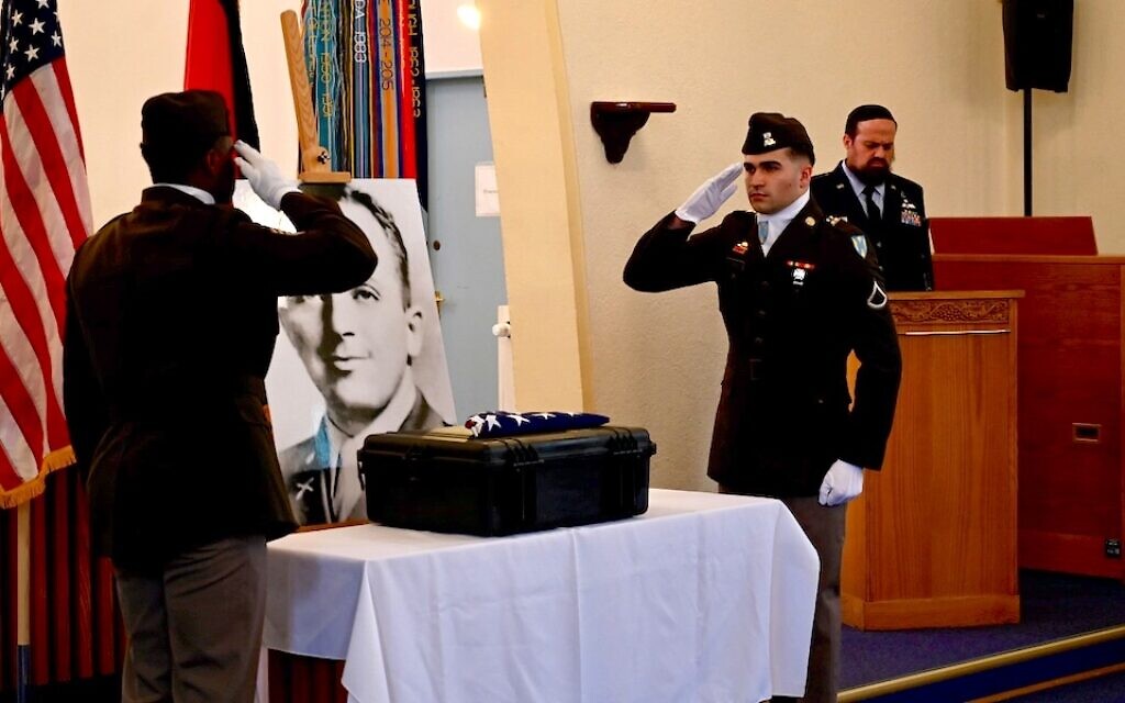 German and American soldiers at Ramstein Air Force Base, Germany honor Nathan Baskind's remains after their excavation. (U.S. Army)