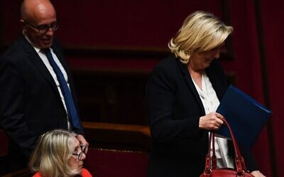 President of the French conservative party Les Republicains and member of Parliament Eric Ciotti and far-right National Rally president Marine Le Pen attend a session of the National Assembly in Paris, April 4, 2023. (Christophe Archambault / AFP via Getty Images via JTA)