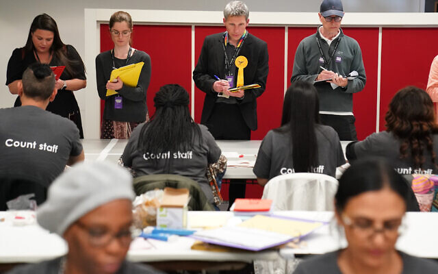 Political agents watch as counting commences for the Holborn and St Pancras constituency in the 2024 General Election at the headquarters of Camden Council at 5 Pancras Square in Camden, north London. Picture date: Friday July 5, 2024. PA Photo. See PA story POLITICS Election. Photo credit should read: Stefan Rousseau/PA Wire