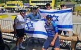Sylvan (left) with fans proudly displaying the Israeli flag