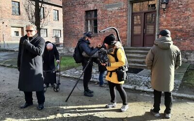 Director Daniela Völker filming at Auschwitz with the son and grandson of the camp Commander