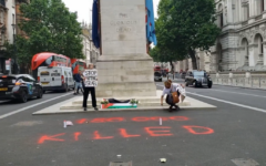 Women from the protest group Youth Demand, laying flowers and a Palestinian flag in front of the Cenotaph in Whitehall, before spray-painting “150,000 killed” on the pavement in front of the memorial. Women from the protest group Youth Demand, laying flowers and a Palestinian flag in front of the Cenotaph in Whitehall, before spray-painting “150,000 killed” on the pavement in front of the memorial.
