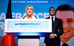 French far-right National Rally party leader Marine Le Pen (left) speaks as party President Jordan Bardella stands to her side in Paris, on June 9, 2024. (Julien De Rosa/AFP)
