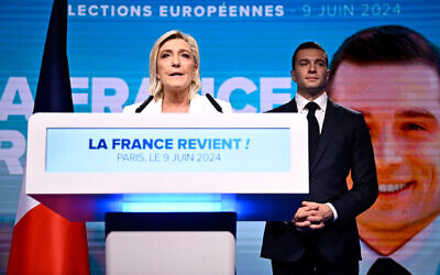 French far-right National Rally party leader Marine Le Pen (left) speaks as party President Jordan Bardella stands to her side in Paris, on June 9, 2024. (Julien De Rosa/AFP)
