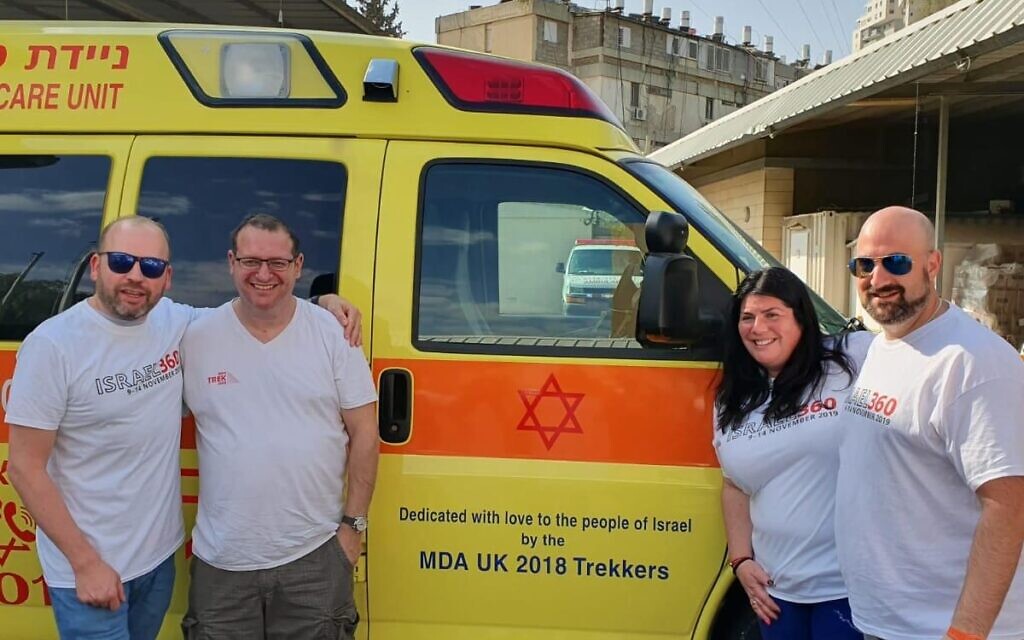 The ambulance bought by a British group of trekkers in 2018. Left to right: MDA UK chief executive Daniel Burger and trekkers Gary Harman, Susie Segal and Robert Ordever.
