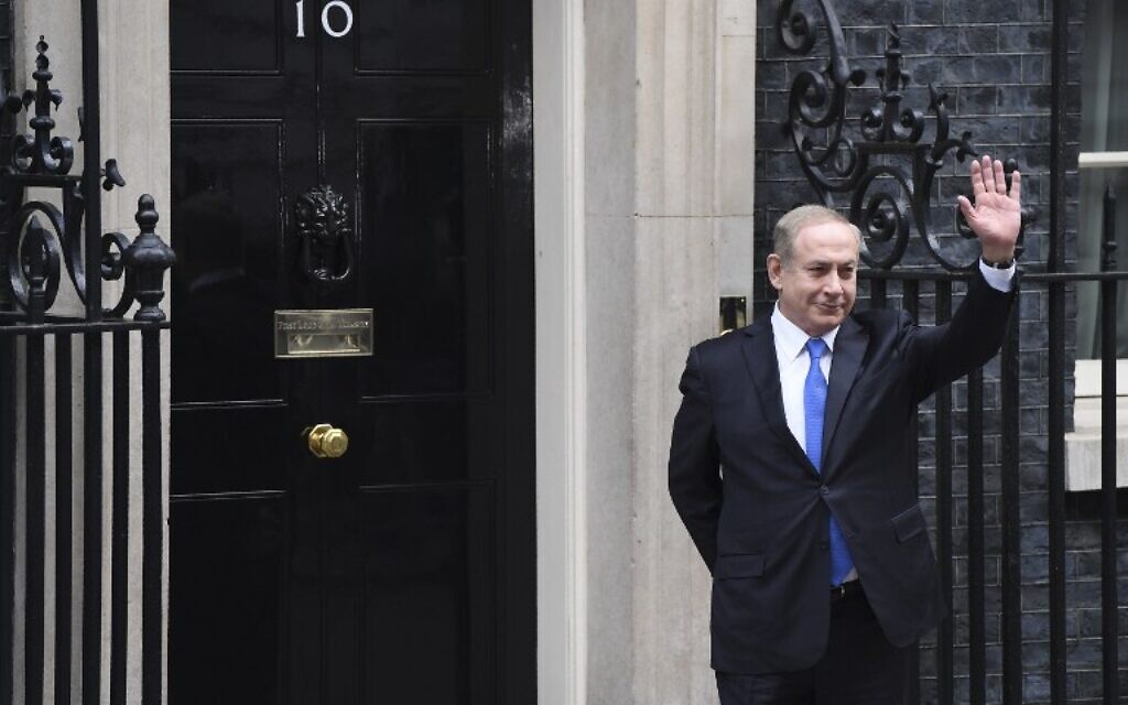 Israeli Prime Minister Benjamin Netanyahu waves to the media after arriving at 10 Downing Street in 2017