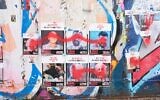 Defaced posters showing some of the Israeli hostages in the Primrose Hill area of north London