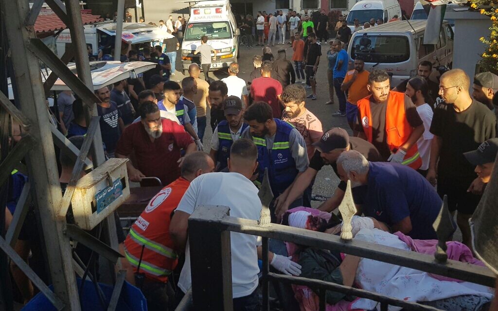 Civil Defense first-responders carry a man who was wounded after his handheld pager exploded, in the southern port city of Sidon, Lebanon, Tuesday, Sept. 17, 2024.(AP Photo)