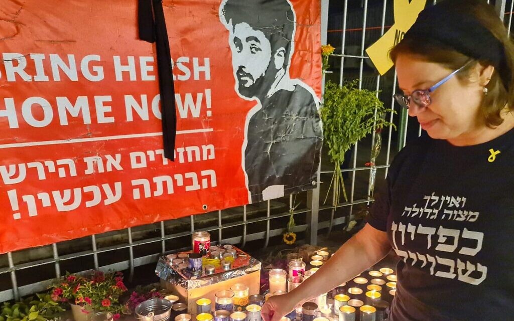 Shira Ben-Sasson, a founder of the Hakhel synagogue in Jerusalem, lights a candle in memory of Hersh Goldberg-Polin, Sept. 1, 2024. (Deborah Danan)