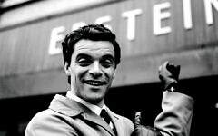 Jacob Fortune-Lloyd as Brian Epstein outside the reimagined Epstein store started by his grandfather