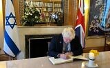 Former prime minister Boris Johnson signing Book of Reflection, Israel Embassy, UK, 7 October 2024