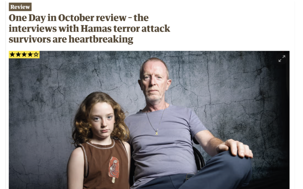 The review is accompanied by a photo of Tom Hand with his daughter Emily, who spent 50 days in Hamas captivity