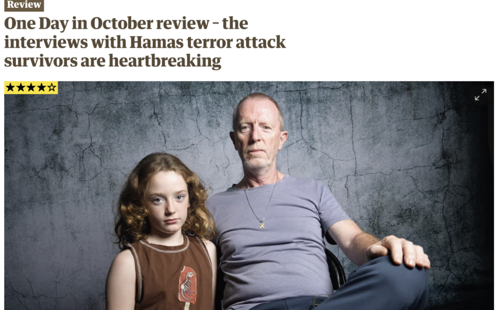 The review is accompanied by a portrait of Tom Hand with his daughter Emily, who spent 50 days in Hamas captivity